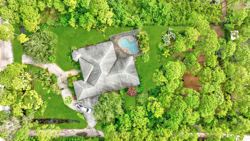 Photo of 5000 Slash Pine Trail, Fort Pierce, FL 34951 (MLS # R11013412)