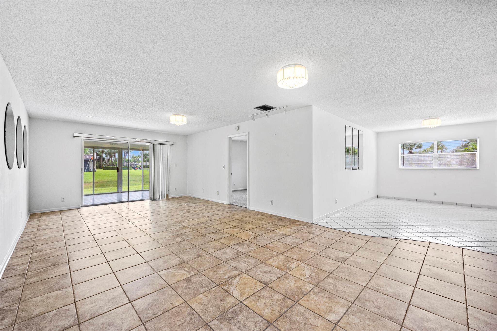 Welcome to the largest waterfront villa available in the desirable newer section of Golden Lakes! This spacious and light-filled 2 bedroom, 2 bathroom home offers comfort, style, and serene water views--all in a peaceful 55+ community in the heart of West Palm Beach.Step inside to find an open and welcoming floor plan, thoughtfully designed for easy living and entertaining. The oversized, fully enclosed patio is under air, providing the perfect flexible space for a cozy den, hobby room, or simply relaxing while enjoying tranquil lake views year-round.Both bedrooms are generously sized, with ample closet space and natural light. The primary suite features its own private bathroom for added convenience and comfort. The second bedroom is perfect for guests or can serve as a home