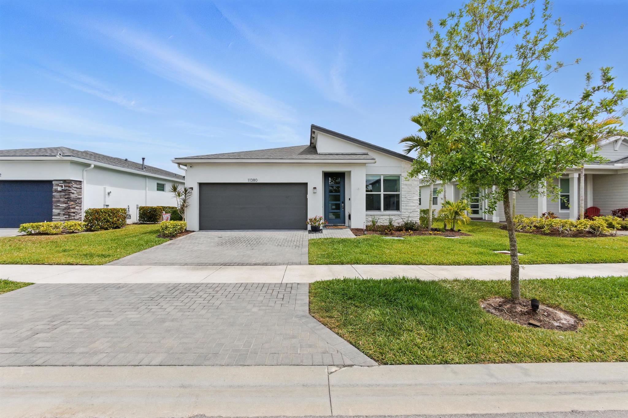Stunning 4-Bed, 3-Bath Home in Tradition - Lake View!This beautifully maintained 4-bedroom, 3-bath home offers nearly 2,000 sq. ft. of spacious living in the heart of Tradition. Enjoy a versatile layout, a 2-car garage, and a serene backyard with breathtaking lake views--perfect for relaxing or entertaining. The home features a brand-new whole-house water filtration system with a water softener and reverse osmosis system. Full hurricane-impact doors and windows provide added security and efficiency. The patio has been extended by 800 sq. ft. with stunning travertine, creating the perfect outdoor retreat. HOA includes an alarm system, internet, cable, lawn care, irrigation, gym, and clubhouse amenities. Don't miss this incredible opportunity--schedule your showing today!