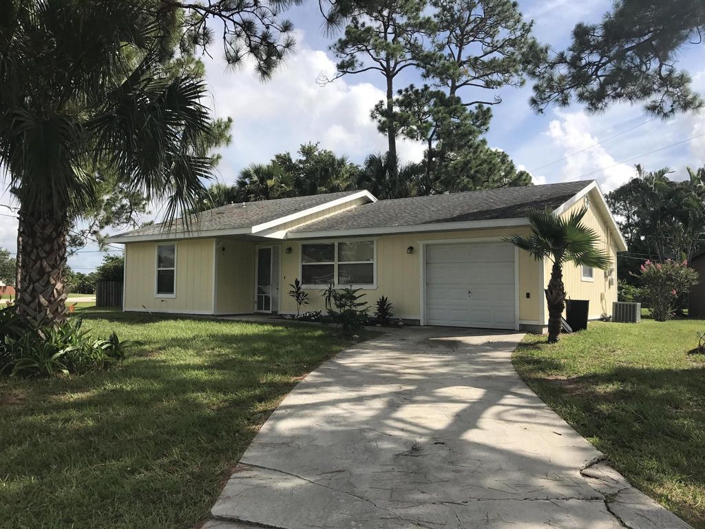 Photo of 1297 SW Fountain Avenue SW, Port St Lucie, FL 34953 (MLS # R10921407)