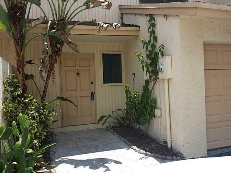 Totally updated townhome in immaculate condition in the great town of Davie. All tile floors, updated kitchen cabinets with stainless appliances, and updated bathrooms. Close to Educational HUB of Broward, shopping and restaurants. Plenty of Storage, walk in closets in both rooms, Low HOA, wired for ADT, Beautiful private pavered courtyard, great for backyard grilling. Don't miss this beautiful townhome ready for you to move in.