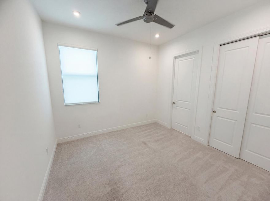 Introducing 2744 SE Ashfield Dr, a residence arranged for everyday practicality, featuring a kitchen with an accent backsplash and all stainless steel appliances. The kitchen includes a functional island, complementing the primary bathroom's layout with double sinks. An exterior covered patio provides a dedicated space for outdoor use. This property presents a well-appointed design focused on daily living.. Included 100-Day Home Warranty with buyer activation