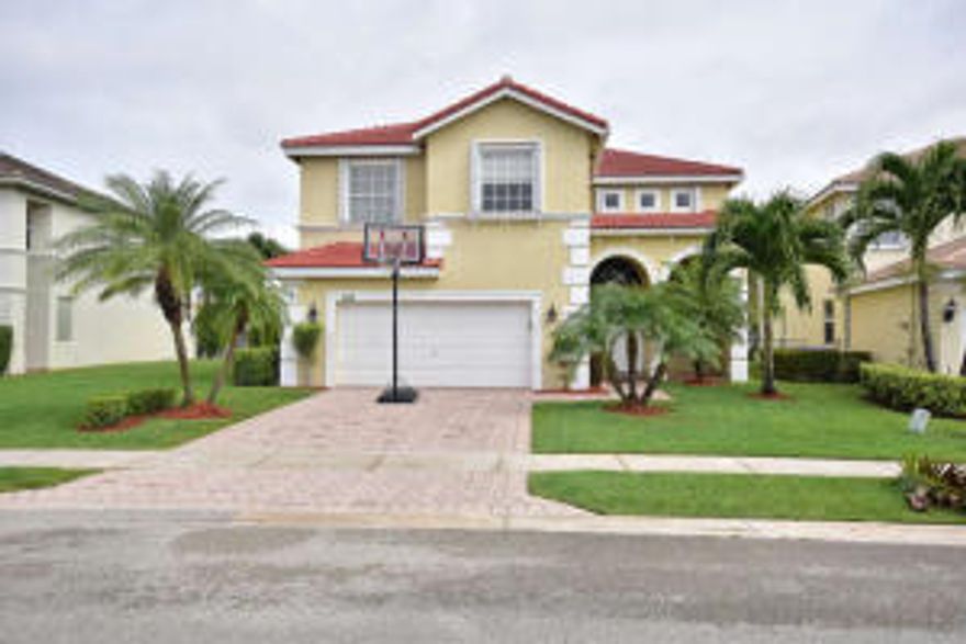 SPECTACULAR UPGRADED LAKEFRONT HOME IN BEAUTIFUL GATED COMMUNITY WITH CLUBHOUSE & TENNIS COURTS. NEW ROOF.  HOME FEATURES VAULTED CEILINGS, UPGRADED 18 X 18 TILE DOWNSTAIRS,LIVING ROOM HAS CUSTOM PICTURE FRAME MOLDING. CUSTOM PAINT & DECOR THROUGHOUT THE HOME. HALF BATH WITH TRAVERTINE TILE. UPGRADED MAPLE KITCHEN WITH 42'' CABINETS,STAINLESS APPLIANCES,PANTRY AND BREAKFAST BAR. UPSTAIRS MASTER SUITE FEATURES DOUBLE DOOR ENTRY, TRAY CEILING, SPACIOUS OVERSIZED SITTING AREA AND LUXURIOUS BATH WITH WHIRLPOOL TUB, WALK-IN CUSTOM CALIFORNIA CLOSET. ALL BEDROOMS HAVE CUSTOM CLOSETS.  LAUNDRY ROOM WITH BUILT-IN SINK & CABINETRY. CENTRAL VAC., SECURITY SYS, INTERCOM SYSTEM, COVERED/PAVERED PATIO. OVERSIZED LOT EASEMENT. ACCORDIAN SHUTTERS ON 2ND STORY & FAMILY ROOM SLIDING DOOR. PAVERED DRIVEWAY. A-RATED SCHOOLS. CONVENIENT LOCATION... MINUTES TO WELLINGTON GREEN MALL, UPSCALE RESTAURANTS, MAJOR AIRPORT AND TURNPIKE. HOME IS TRULY IMMACULATE AND MOVE-IN READY.