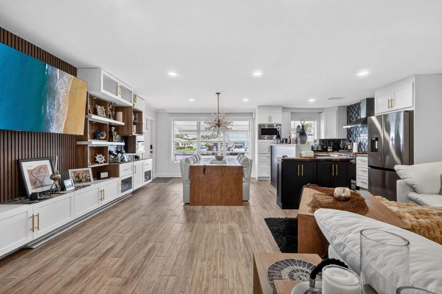 RARELY AVAILABLE and completely renovated from the studs up, this stunning high-point unit is truly one of a kind. This home features a 1 bedroom and versatile lanai ideal for guests with access to a full bathroom. CUSTOM-designed with a refined designer touch, it offers a butcher-block kitchen, extra-large walk-in shower, custom walls, and LOTS of STORAGE. Enjoy exceptional privacy with no neighbors behind you. Community pool. Prime location close to downtown Atlantic Avenue, major highways, shopping, dining, and medical facilities. **Owner open to seasonal or annual rental.**