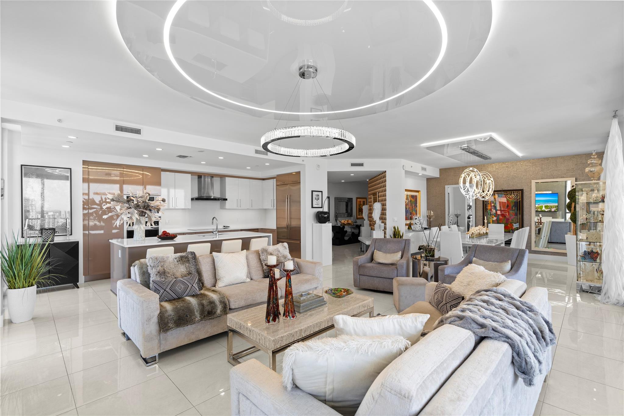 Step into this designer-inspired corner residence, Nestled in the prestigious Las Olas district, Features 3 bedrooms 2.5 bathrooms, no detail has been left untouched. The unit boasts numerous upgrades, including custom indirect lighting that sets a sophisticated tone throughout. Seamless flow of the open floor plan, transitioning effortlessly from the living area to the dining space, and into the state-of-the-art kitchen. Here, you'll find European cabinetry, stainless steel appliances, and elegant quartz countertops, making it a chef's dream. Floor-to-ceiling windows illuminate the space with natural light and lead to an expansive balcony, perfect for entertaining or simply relaxing. Revel in the vibrant ambiance of Fort Lauderdale lifestyle.