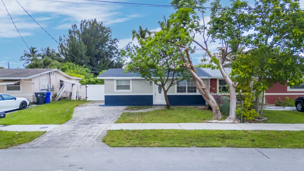 Photo of 1523 SW 68th Way, North Lauderdale, FL 33068 (MLS # B26044140)