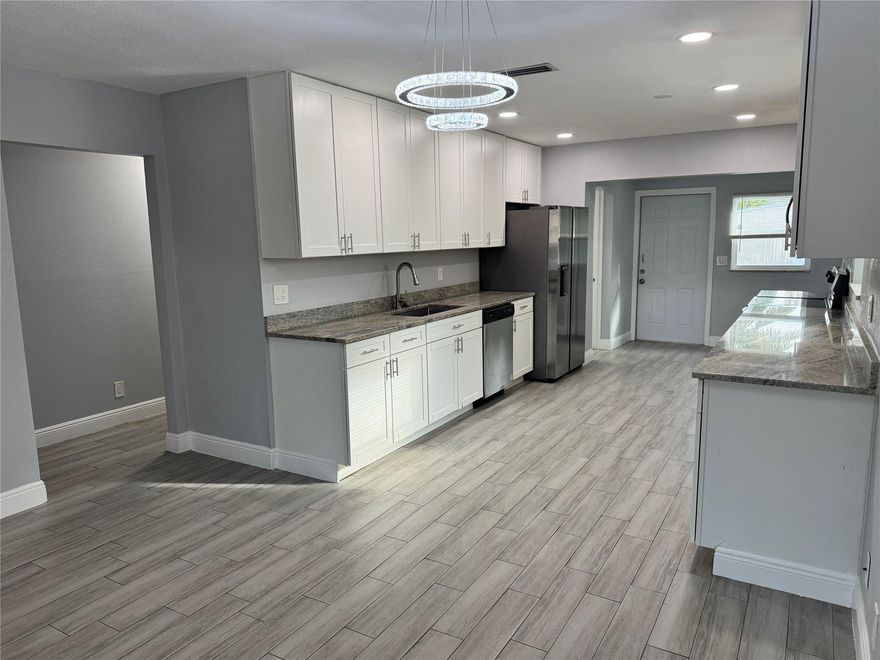 This beautiful and renovated home is in the heart of Pompano Beach. Nice layout features 3 bdrm/2 bathrooms on one side of the house with laundry facility in between. Modern spacious living-dining room area and an incredible kitchen with an open concept layout, SS appliances and beautiful granite countertops. Natural light floods the house. Everything remodeled in 2022, including a/c and roof. Large and private backyard, perfect for outdoor grilling and entertaining. Trampoline & Basketball Hoop a plus! GREAT LOCATION!! Minutes to I95, airport and beach. Don't miss this opportunity to make this your next home! NO HOA, great landlords that take pride in their home ownership. Tenant responsible for electric, water/sewer/trash, cable/internet, yard work. Fast move-in process. Good credit pls!