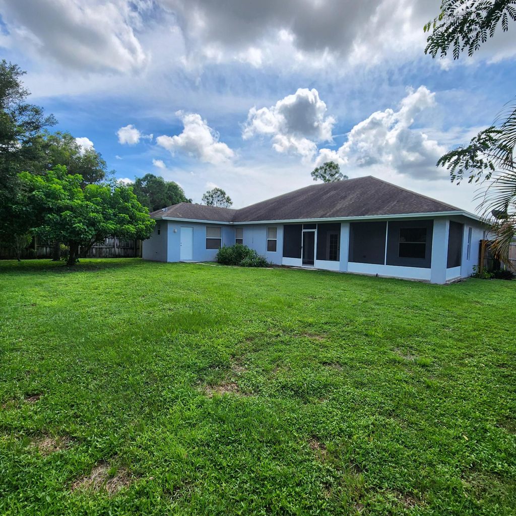 Photo of 451 SW Laconic Avenue, Port Saint Lucie, FL 34953 (MLS # R10966858)