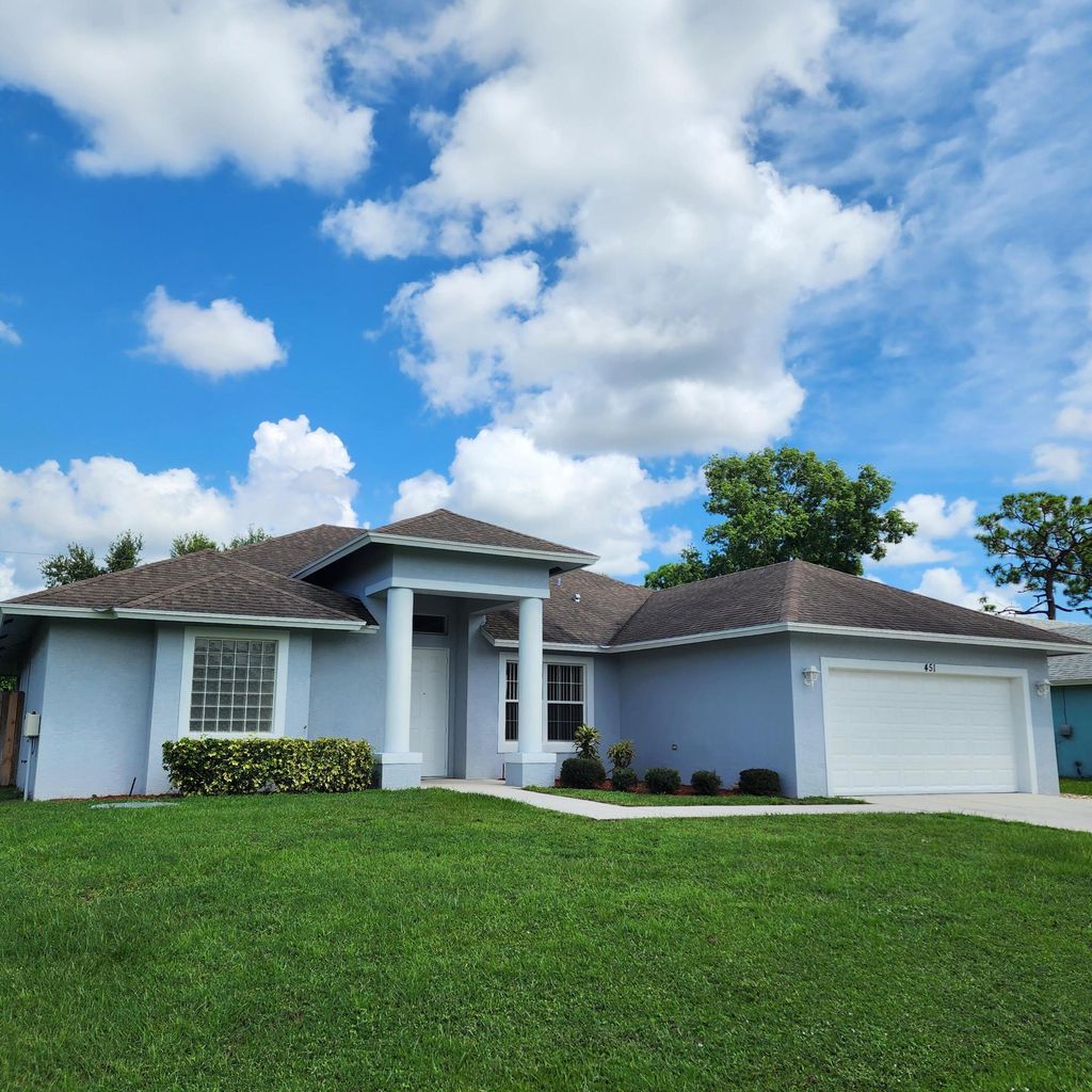 Photo of 451 SW Laconic Avenue, Port Saint Lucie, FL 34953 (MLS # R10966858)
