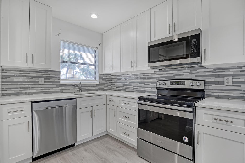 Photo of 4575 LUCERNE LAKES Boulevard #103, Lake Worth, FL 33467 (MLS # B26091774)