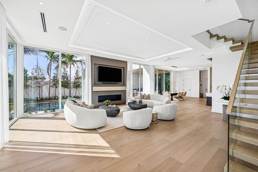 310 Grove - DELIVERY Q1 2026. Welcome to Grove Estates, Downtown Delray's only Gated Single-Family Home Community built by award-winning Azure Development. The Oasis model in Grove Estates sets a new standard of luxury living in downtown Delray Beach within true walking distance to Atlantic Ave. Just over 3 blocks to Atlantic Avenue and 2 blocks to Pineapple Grove. This brand-new residence offers 5 bedrooms, 5 full bathrooms, 2 powder rooms, large flexible club room with bar, office, lounge, & over 5,400sf of expertly crafted interior living space. Designed with clean lines, soaring ceilings, & expansive 12' floor to ceiling windows, this home is bathed in natural light & built for seamless indoor-outdoor living. Covered lanai with summer kitchen & views of the pool, with sunshelf & spa. Only 5 homes remain in Grove Estates with 4 homes already sold. This home will be completed and ready for move-in Q1 of 2026, with other homes/models shortly after. 310 Grove Pl is a Oasis Farmhouse, but can be customized with mixtures of finishes from the Oasis Modern, if you contract soon.

Designed by celebrated architect Randall Stofft and curated by Czar Interiors, the Oasis model spans 5,429 square feet of air-conditioned living with over 6,600 total square feet of resort-style space. Soaring 12-foot floor-to-ceiling glass windows invite light and lush greenery into every corner of the home, creating a seamless connection to the outdoors. The dramatic floating staircase and private elevator offer both modern flair and convenience, while the thoughtful layout effortlessly blends entertaining and everyday living.

The gourmet kitchen is a chef's dream, outfitted with Wolf and Sub-Zero appliances, custom 12-foot cabinetry, and a hidden butler's pantry. An expansive club room offers full front and back bars and expansive glass doors that open completely to the outdoors, perfect for hosting or relaxing in style.

Step outside into your own private oasis with an oversized saltwater pool, spa and sunshelf surrounded by dense, tropical landscaping for total privacy. The covered outdoor living area features a full summer kitchen, wood-clad ceilings, and concealed retractable screens, allowing for effortless indoor-outdoor entertaining no matter the season. Upstairs, expansive balconies with glass railings overlook the lush central green, a landscaped park exclusive to Grove Estates, ideal for peaceful walks, yoga, or simply taking in the tranquility.

Upstairs, 5 spacious bedrooms include a luxurious VIP suite and a stunning primary retreat, each designed with custom finishes and spa-like bathrooms. A three-car garage, solid steel and concrete second-floor construction, natural gas fireplace, and designer fixtures round out this exceptionally built home that merges quality with artistry at every turn.

With unmatched design, rare privacy, and a location just steps from the energy of downtown Delray, this is your opportunity to claim one of the most exclusive addresses in South Florida.