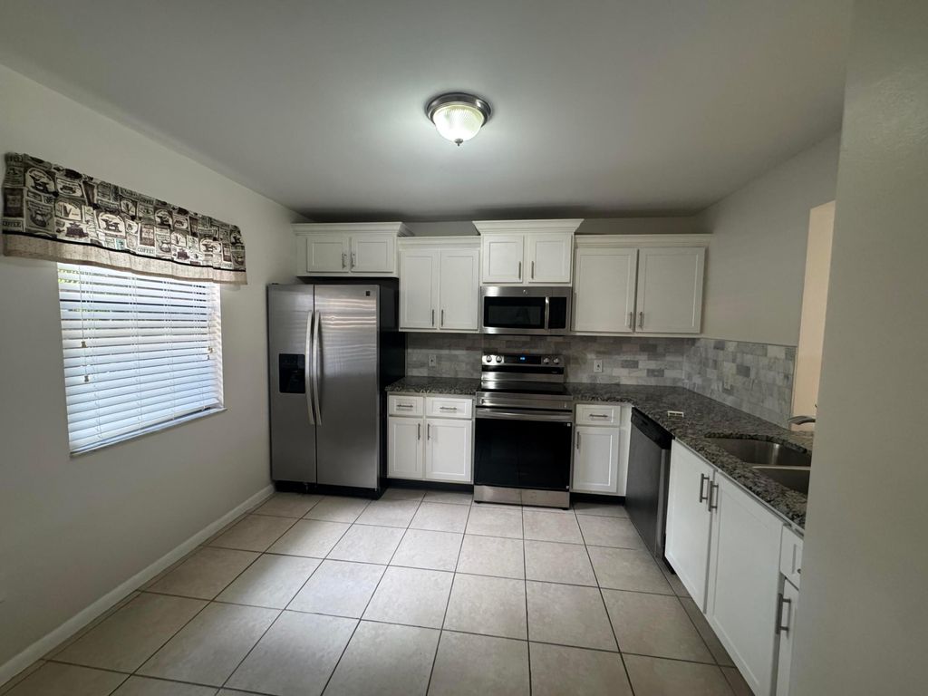 Photo of 2505 Lakeview Circle, Royal Palm Beach, FL 33411 (MLS # R11164856)