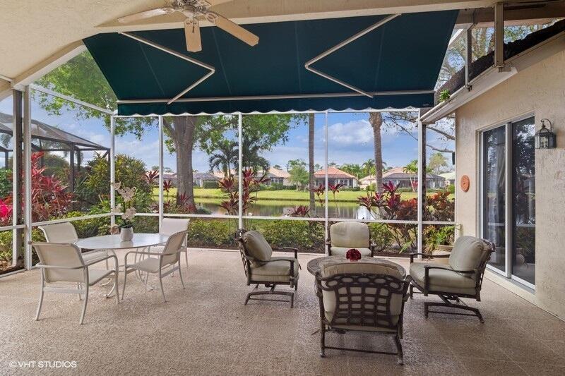 TAKE A SECOND LOOK!NEW ROOF & GUTTERS FEB. 2025! NEW SS OVEN, COOK TOP & MICROWAVE FEB. 2025 & NEW LAMINATE FLOORS IN 2 BEDROOMS INSTALLED FEB. 2025. Welcome to this beautiful Sawgrass floor plan located in highly desirable PGA VILLAGE, offering breathtaking lake views and an abundance of space. As you enter, you're greeted by a spacious Living room with adjacent formal dining area & a bright open kitchen featuring stainless steel appliances, sleek granite countertops, a cozy breakfast nook, and a convenient snack bar--perfect for entertaining or enjoying everyday meals. The master suite is a true retreat, with a private sitting area and sliding doors that open to the peaceful covered lanai, where you can unwind while enjoying the serene surroundings. The lanai is enhanced with an