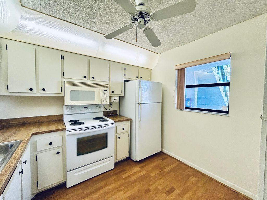 Photo of 7214 Golf Colony Court #101, Lake Worth, FL 33467 (MLS # R11162801)