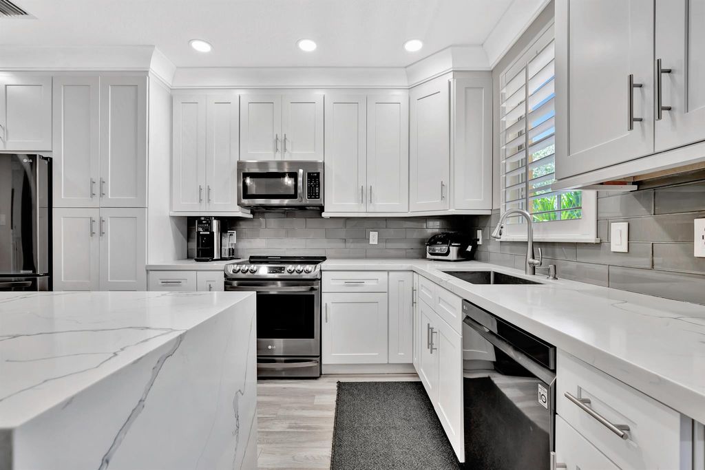 Photo of 2625 Ravella Lane, Palm Beach Gardens, FL 33410 (MLS # R11075995)