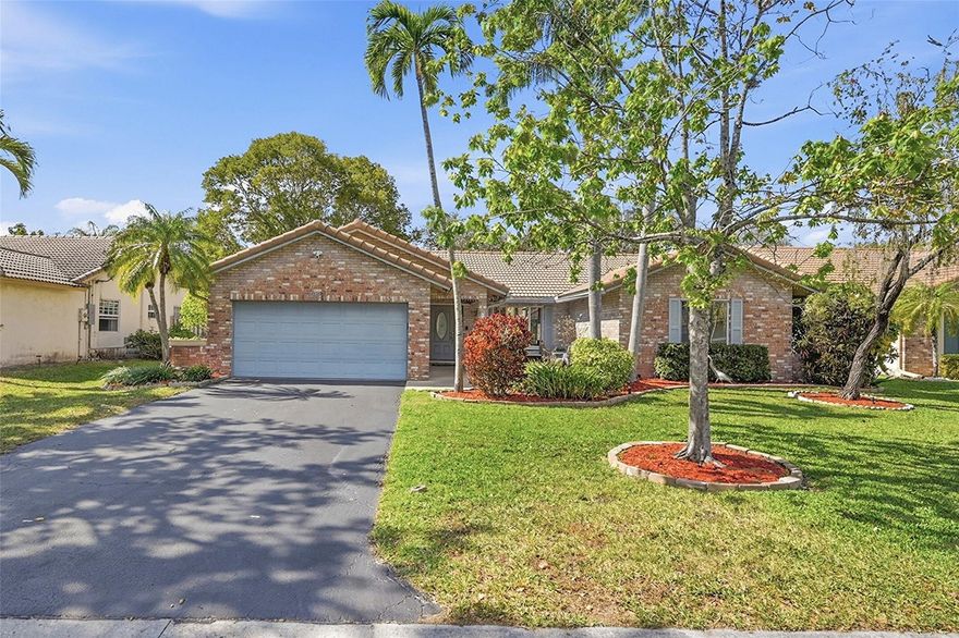 This exceptional single-family residence is situated in the desirable community of Coral Springs, Florida. Offering 4 bedrooms and 2 full bathrooms, this over 2,000 square foot property is designed for both comfort and functionality. The attached two-car garage provides ample parking and storage, while the meticulously landscaped exterior enhances curb appeal. Upon entering, you will appreciate the thoughtfully designed layout featuring a foyer with vaulted ceilings and a spacious living area filled with natural light. The kitchen, equipped with modern stainless steel appliances, wood finish cabinetry, and a generous granite counter tops, ideal for culinary enthusiasts. The primary suite includes 2 walk-in closets and an elegantly appointed bathroom, ensuring privacy and convenience. The outdoor space is a highlight, featuring impact windows, a fenced backyard with a private in-ground saltwater pool, sunroom, and patio area, perfect for entertaining or relaxation. This property is situated in a suburban neighborhood, no HOA with access to parks, schools, and shopping, making it an excellent choice for families and investors alike. This residence represents a unique opportunity to acquire a well-appointed home in a thriving community.