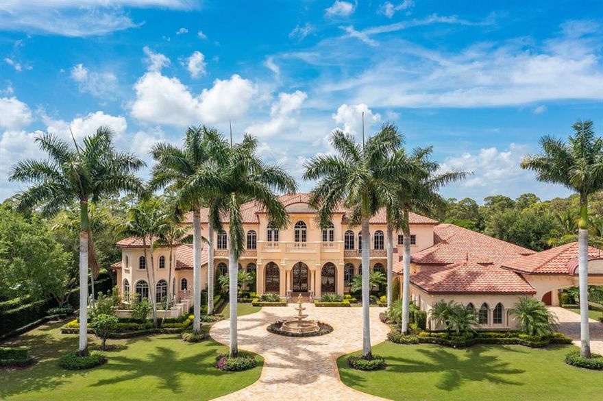 Few residential properties complement their natural surroundings quite like this epic, Mediterranean-style masterpiece, seamlessly tucked into a storied slice of South Florida. Old Palm Golf Club, built on the last parcel of land owned by famed real estate investor John D. MacArthur's foundation, provides the lush backdrop for this throwback ode to sprawling splendor, a stately setting with more than 13,580 square feet of sophisticated living spaces. The five-bedroom layout (with six full baths and one half-bath) overlooks the 16th hole of the perfectly manicured Old Palm championship course designed by legendary PGA golfer Ray Floyd. The same attention to outdoor aesthetic detail is reflected in the artfully rendered landscaping that beautifully frames a two-story design encompassing more than 20,000 square feet overall.
Inside, a sense of European glamour fills an entry way with a dramatic double staircase, setting a stylish tone for what's to come. Rooms with volume ceilings, flooring cast in marble and onyx, exquisite molding, and hand-painted ceilings, catch the eye at every turn. Interior features include a mammoth master suite with a sitting area and gas fireplace; a stunning master bath with two walk-in showers and a luxurious whirlpool spa-tub; a club room; a cinema-styled theater room; a handsome gourmet kitchen with custom wood cabinetry; a secondary indoor summer kitchen for events and entertaining; and much more.
A pool area that recalls a luxury resort setting is the centerpiece of a backyard area with a spacious covered loggia, summer kitchen and pergola-covered spa.
Residents of Old Palm Golf Club have access to a variety of high-end amenities, including four world-class dining options at the clubhouse, on-site concierge service, a spa and fitness center, and Beach Club access to additional amenities at nearby Hilton Singer Island.