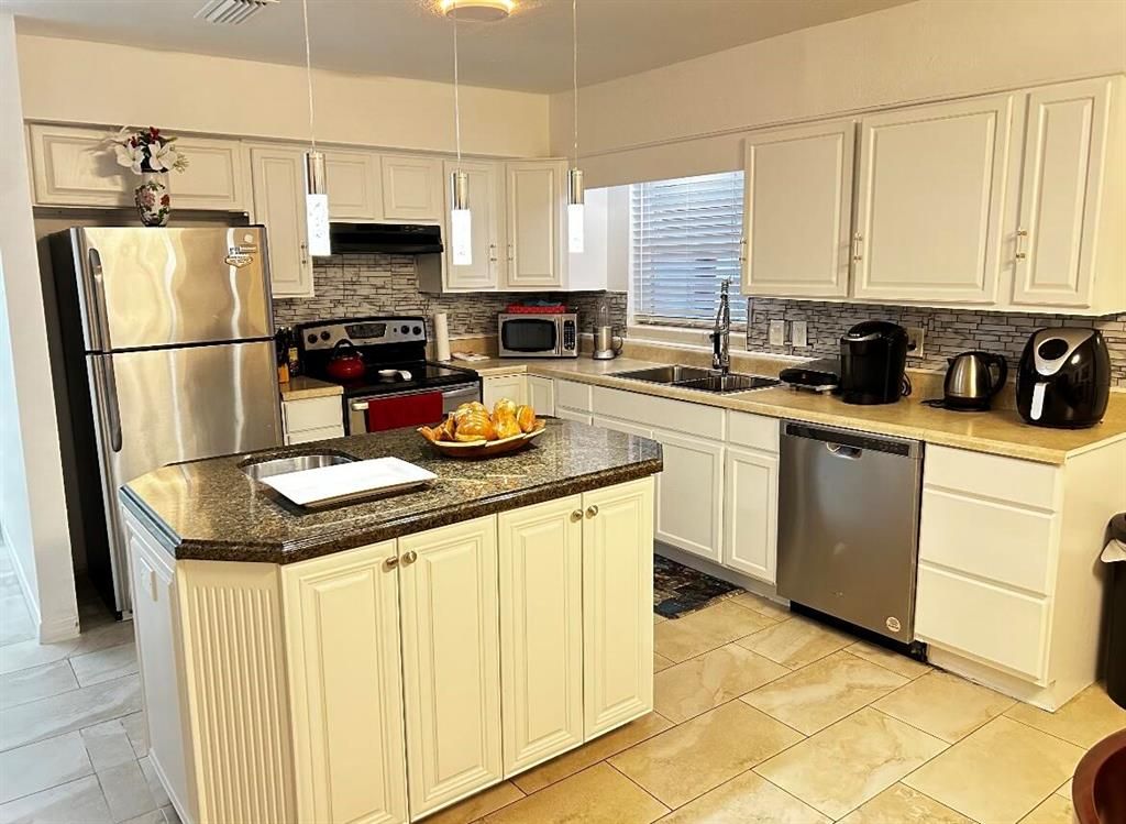 Photo of 567 SE Se Euclid Ln, Port St Lucie, FL 34983 (MLS # R10889943)