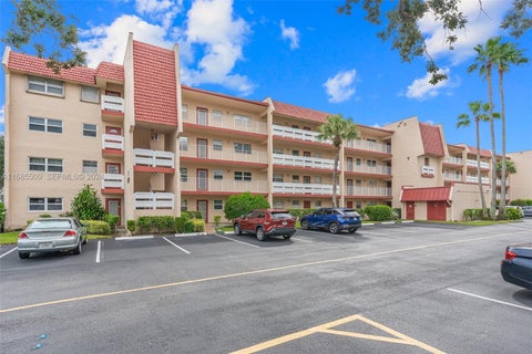 Photo of 1015 Country Club Drive #307, Margate, FL 33063 (MLS # B26036011)