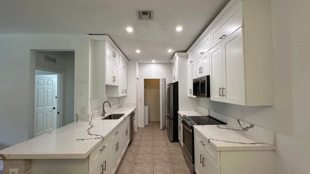 Photo of 3549 Forest Hill Boulevard #19, Palm Springs, FL 33406 (MLS # B26001354)