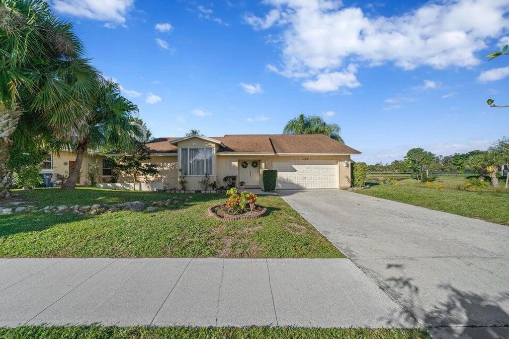 Photo of 148 Ponce De Leon Street, Royal Palm Beach, FL 33411 (MLS # R11165018)