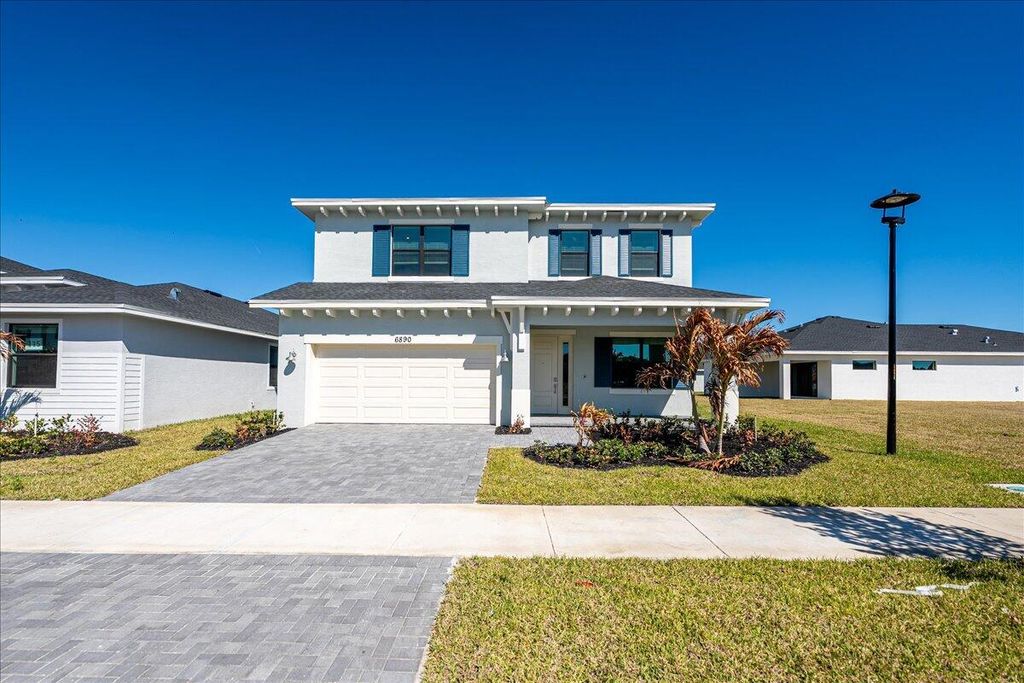 Photo of 6890 NW Kestrel Lane, Port Saint Lucie, FL 34987 (MLS # R11165057)