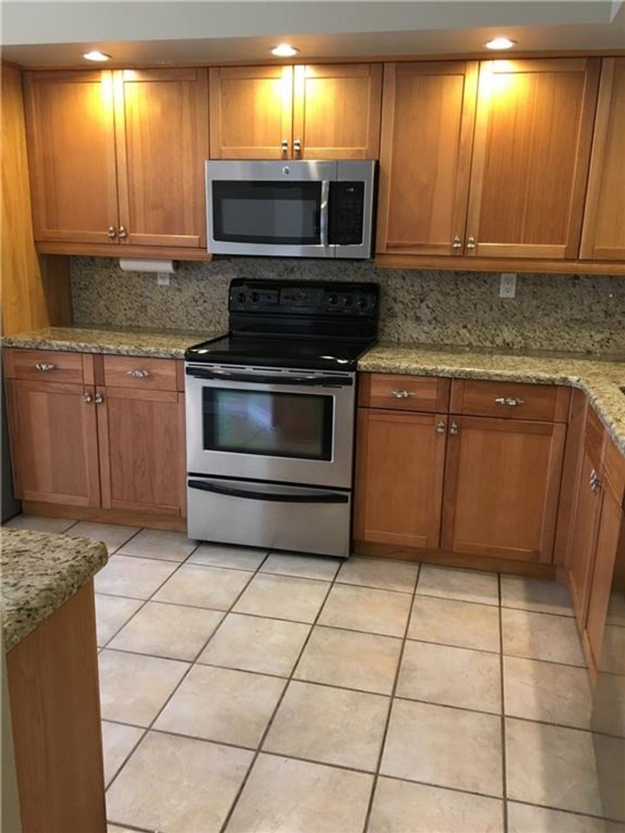 Completely remodeled, totally move in ready, just bing your toothbrush and slippers!  Waterfront view, cul-de-sac, beautifully updated, Great floor plan, two patios, master bath and suite downstairs, 1/2 bath down, 2 bed/bath upstairs, large closets with builtins, open kitchen and living space, wet bar, brand new washer/dryer, water-7 yrs, A/C-9 months old, totally hurricane proof, stainless steel appliances, refrigerator-1 yr old, eat in kitchen, 1 car garage, beautiful view of lake, great community.