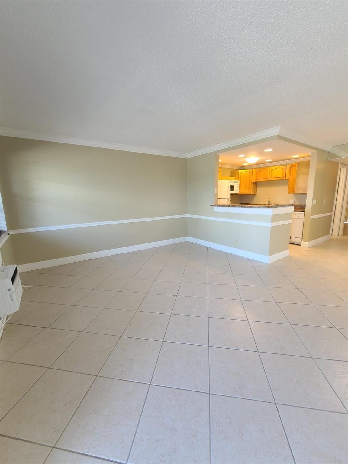 Welcome to this charming 1-bedroom, 1-bathroom condo located on the 2nd floor in the desirable Century Village 55+ Community! This unit features an upgraded open kitchen, perfect for entertaining. Freshly painted with tile flooring throughout, this condo is move-in ready and designed for comfortable living. Experience the Florida lifestyle with access to amazing amenities, including a state-of-the-art fitness center, a vibrant clubhouse, and free transportation services. Enjoy the peace of mind that comes with a secure community and the convenience of being close to the PBI airport, shopping centers, beautiful beaches, and a variety of restaurants. Don't miss out on this fantastic opportunity to live in a community that offers everything you need for an active and enjoyable lifestyle.