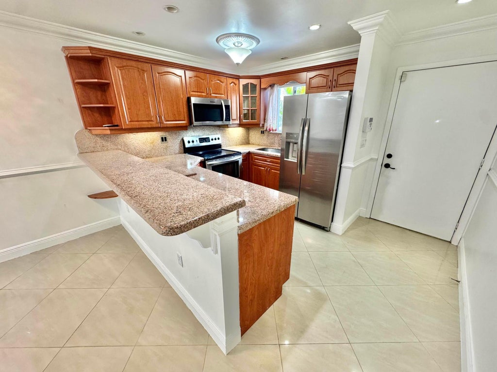 Photo of 6074 FOREST HILL Boulevard #107, West Palm Beach, FL 33415 (MLS # B26075261)