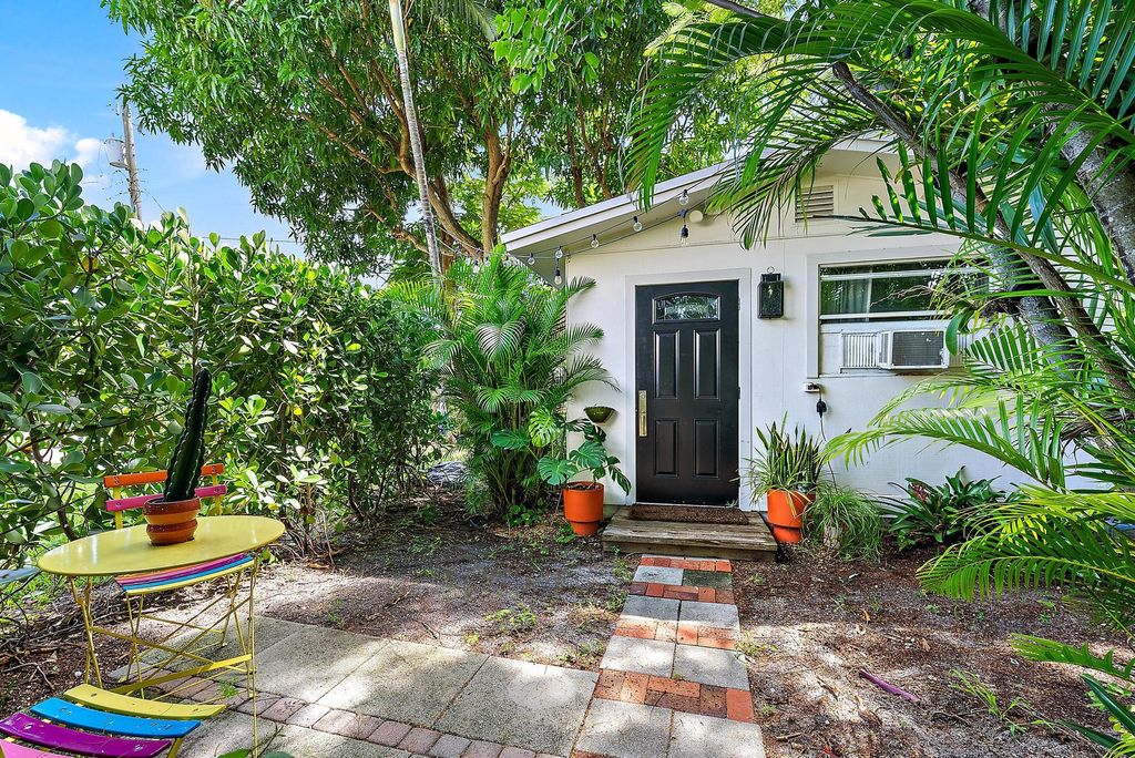 Photo of 328 Hawthorne Drive, Lake Park, FL 33403 (MLS # B26023604)