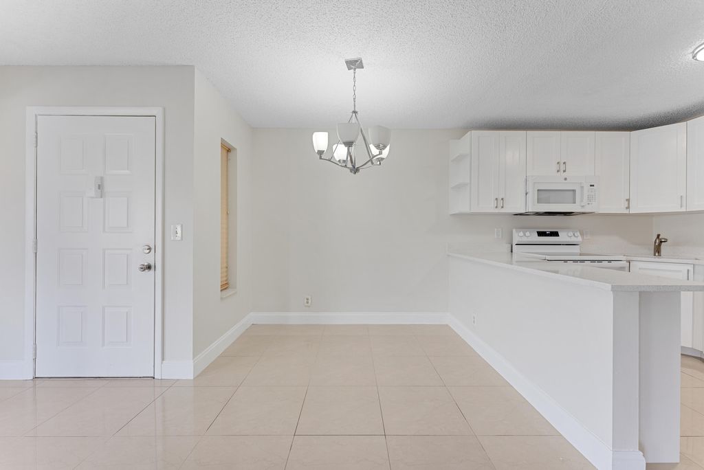 Photo of 537 Shady Pine Way #D-2, Greenacres, FL 33415 (MLS # R11053560)