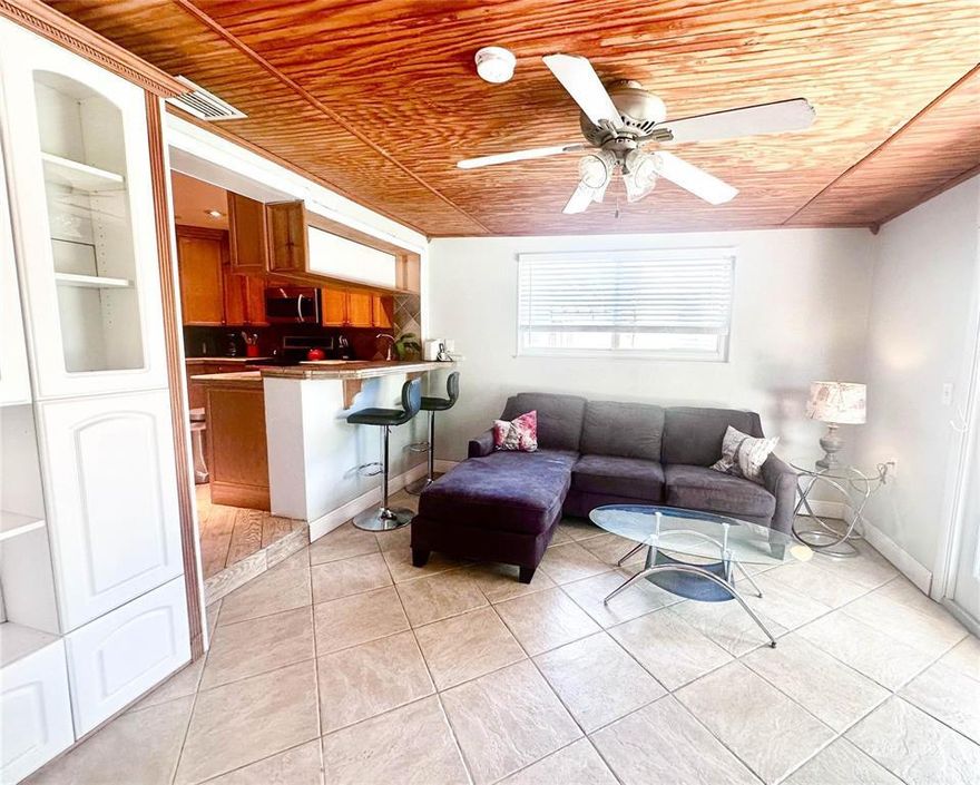 Step inside and feel the warmth of a true Florida retreat, anchored by a wood-burning fireplace that adds character you simply don't find in today's cookie-cutter homes. The kitchen blends timeless style with function, featuring Italian tile counters, wood cabinetry, and SS appliances—perfect for everyday living or entertaining with ease.  This home offers a rare and highly desirable layout with two bedrooms featuring en suite bathrooms, including a separate income-producing opportunity. One suite was previously a licensed Airbnb, ideal as guest quarters, or mother-in-law suite—giving you flexibility and potential revenue from day one.  Major updates bring peace of mind:  Roof just 3 years old Impact windows and doors throughout Updated electrical and newer AC.  Step outside and you'll find your own private tropical escape  A saltwater pool is surrounded by a paver patio, lush mature landscaping, and a unique sandy beach-style area—all enclosed by a privacy fence for the ultimate backyard oasis. And the location? Hard to beat. You're less than 5 miles to the beach at Lauderdale-By-The-Sea, with no flood zone concerns—meaning lower insurance costs and greater peace of mind. Whether you're looking for a primary residence, multi-generational living, or a savvy investment opportunity, this home checks every box and then some. Opportunities like this in Twin Lakes North don't last—schedule your private showing today before this hidden gem is gone.