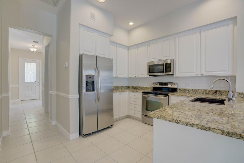 Photo of 256 San Remo Drive, Jupiter, FL 33458 (MLS # B26045157)