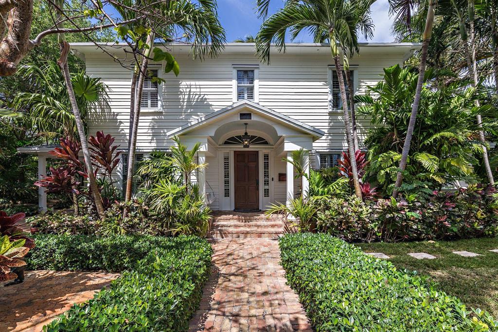 ''CROTON HOUSE'' circa 1921. Situated on a DOUBLE LOT with 110 ft. of frontage this stunning 2-story 3-bedroom, 2.5 bath home is straight out of a Hemingway novel. Lush tropical landscaping includes many specimen palms, oaks, flowering shrubs, and vines. This property also features a charming guest house will full bath that could be used as an office, artist studio or gym. Main house features include original hardwood floors, fireplace, beautiful new kitchen, and family area with Italian porcelain tile. Pool is heated with a spa and features a covered pool pavilion for additional outdoor entertaining. Located blocks from the Norton Museum and the intracoastal waterway.