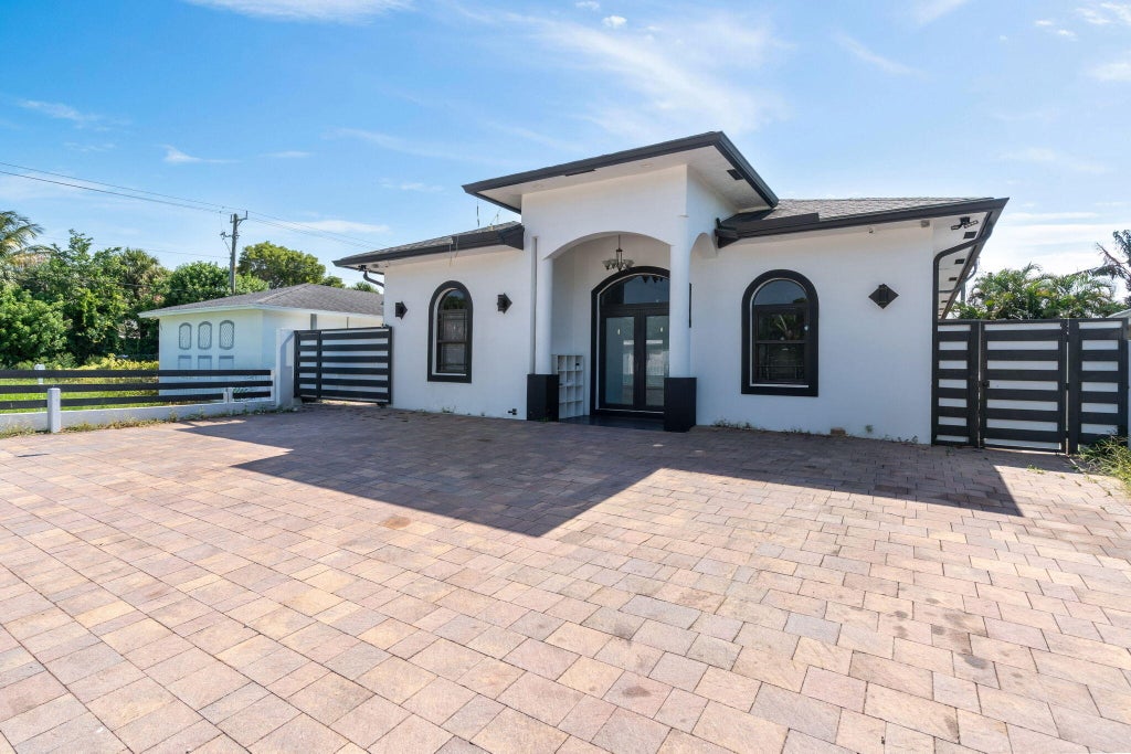 Photo of 725 Mercury Street, West Palm Beach, FL 33406 (MLS # B26044056)