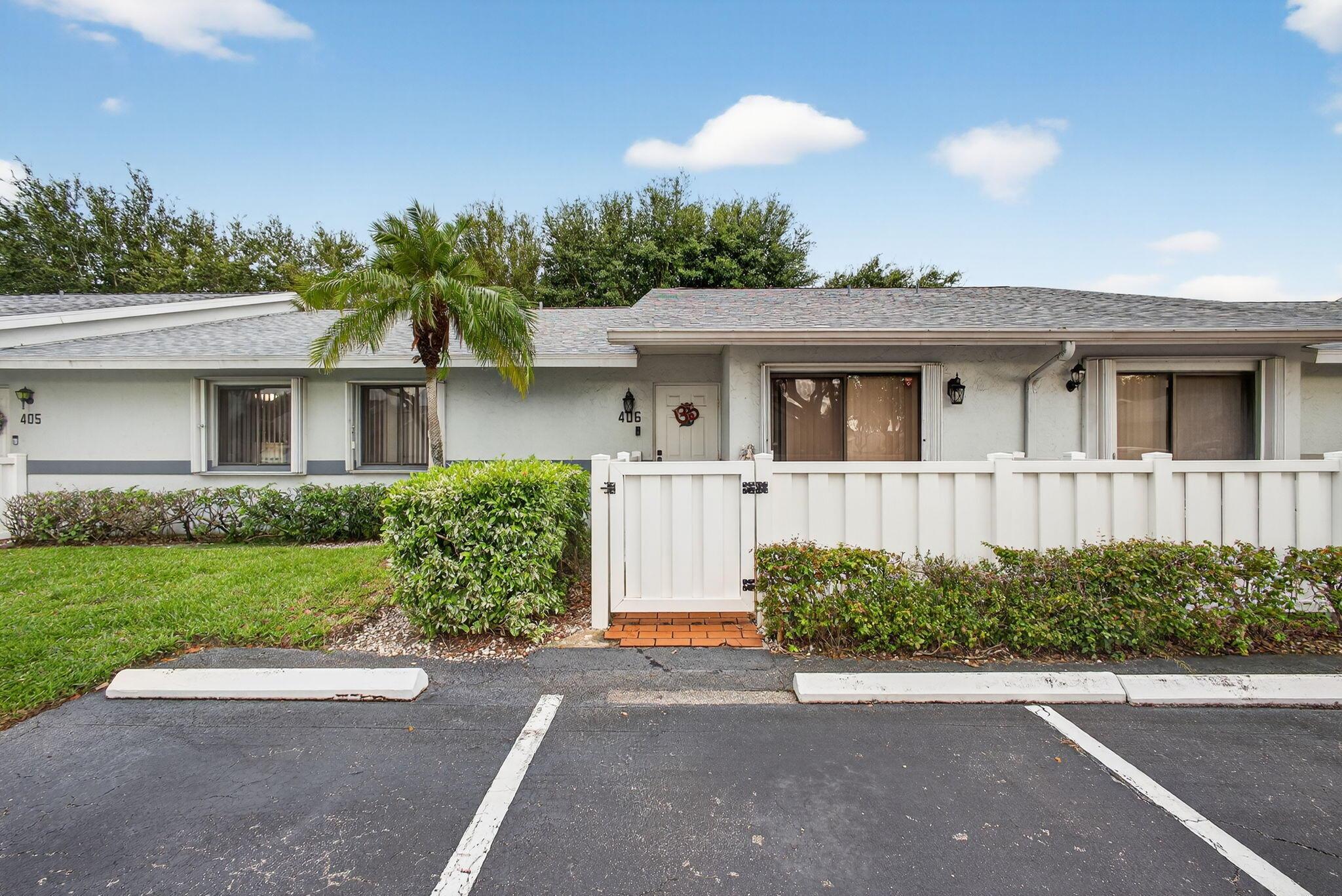 Welcome to The Arbours II, a 55+ community with a pool, clubhouse, and shuffleboard. One pet up to 25 lbs allowed. This 2 bed/2 bath split-floorplan villa features tile throughout, accordion shutters, inside laundry, and an enclosed air-conditioned patio for extra living space. The kitchen is bright with room for a small table and porch access via sliding doors. Vaulted ceilings in the dining/living area create an open feel. Washer/dryer included; furniture negotiable. Two parking spaces outside your door, just 15-20 minutes to the beach, and close to many shopping centers!