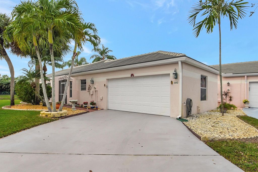 Photo of 1042 Island Manor Drive, Greenacres, FL 33413 (MLS # R10952752)