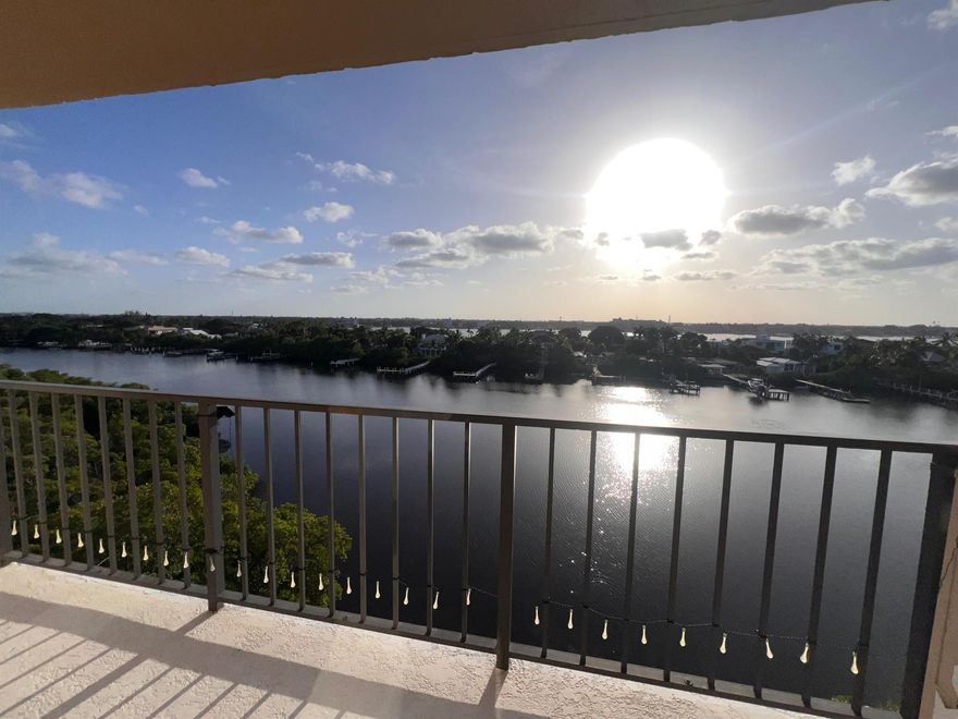 Experience the charm and prestige of Palm Beach living with stunning Intracoastal Waterway views. Located in the coveted 33480 zip code, this residence offers unobstructed Florida sunsets and deeded beach access. Watch sailboats glide by from your wrap-around balcony, or toast the sunset in peace.Inside, impact windows throughout provide serenity. The layout features a foyer entry, split bedrooms, and a kitchen with a sitting bar, pullouts, lazy Susans, and pantry storage. The master suite offers balcony access, a walk-in closet, and a bath with granite counters, a bidet, and linen closet.With an interior washer/dryer, two hall closets, and exterior storage, this home provides luxury and convenience. Schedule your showing today!