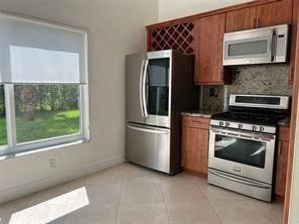 Photo of 9880 Red Heart Lane, Tamarac, FL 33321 (MLS # F10552169)