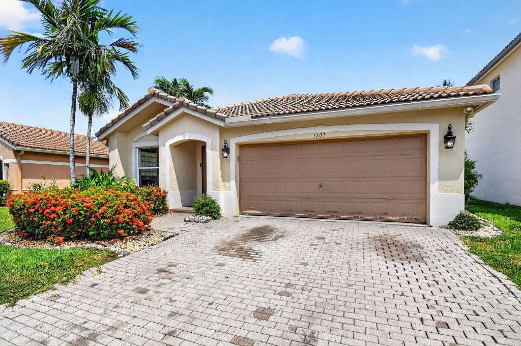 Photo of 1107 Big Torch Street, Riviera Beach, FL 33407 (MLS # B26042976)