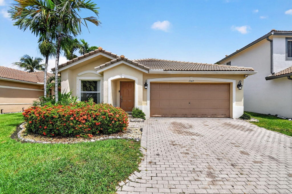 Photo of 1107 Big Torch Street, Riviera Beach, FL 33407 (MLS # B26042976)