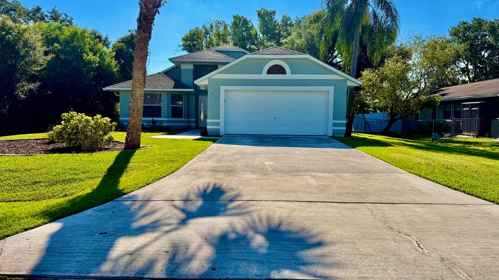Photo of 619 SE Forgal Street, Port Saint Lucie, FL 34983 (MLS # B26041984)
