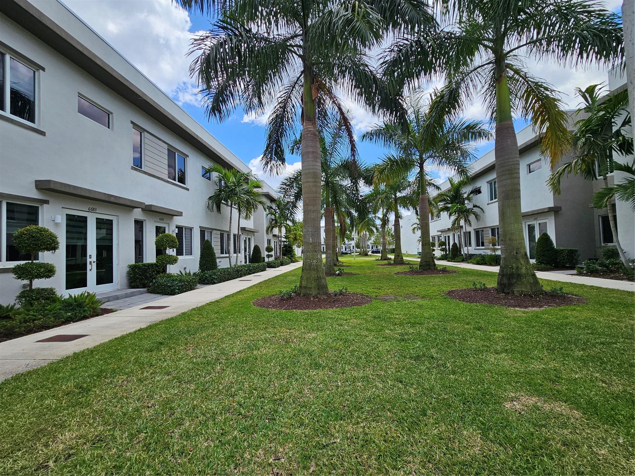 Welcome to this Modern Style Luxury townhouse located in the prestigious Landmark community in Doral. This modern unit features impact windows, 3 bedrooms, 2.5 bathrooms, 1 epoxy painted car garage with two packing spaces on driveway plus guest parking. An open design for living and dining room with quartz countertop, stainless steel appliances, and glass mosaic backsplash in the kitchen. Stainless steel handrail and hardwood stairs that lead to Master bedroom with walk-in closet and master bathroom with his and hers sinks, glass door shower, and separate toilet area; 2 bedrooms sharing a full bathroom, a laundry room with large washer and dryer. Beautiful clubhouse with tennis courts, pool, gym equipped with sauna, pool, and splash zone for kids. Top-tier public and private schools.