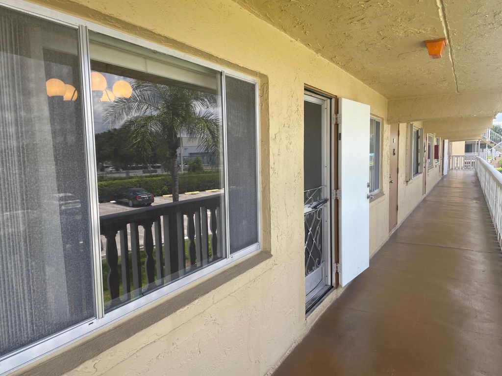 Photo of 500 Village Green Circle W #212, Palm Springs, FL 33461 (MLS # R11117606)
