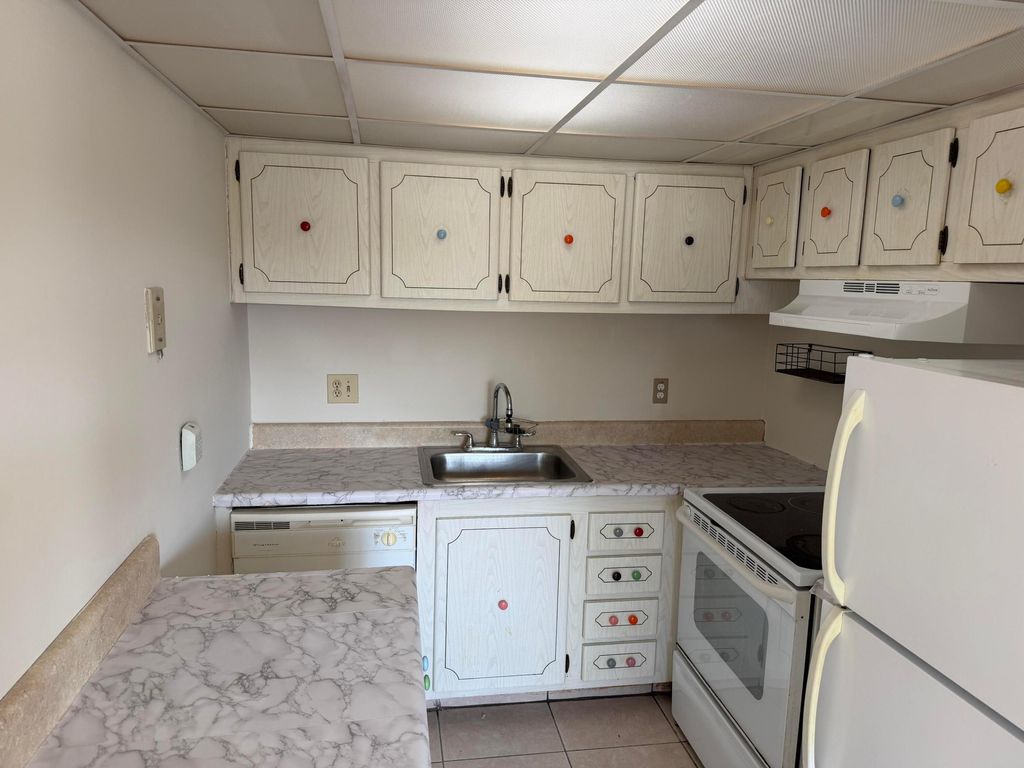 Photo of 500 Village Green Circle W #212, Palm Springs, FL 33461 (MLS # R11117606)