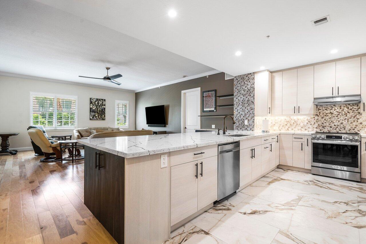 This massive downtown Delray Beach Condo located in the luxurious building of City Walk is one of a kind! With over 2100 sq ft this 2 bedroom 2 and a half bath unit has a large den which you can easily convert to serve as a 3rd bedroom. A jaw dropping newly renovated kitchen is idyllic for cooking or entertaining with friends and family. Hard wood floors throughout all of the living spaces with tall ceilings, solid core doors and generous storage spaces makes this downtown living a dream! Inside the unit is your own washer and dryer with impact windows accompanied by assigned parking and a large walk in storage locker. This unit is fully furnished! Available for an annual lease at $10,000 per month.