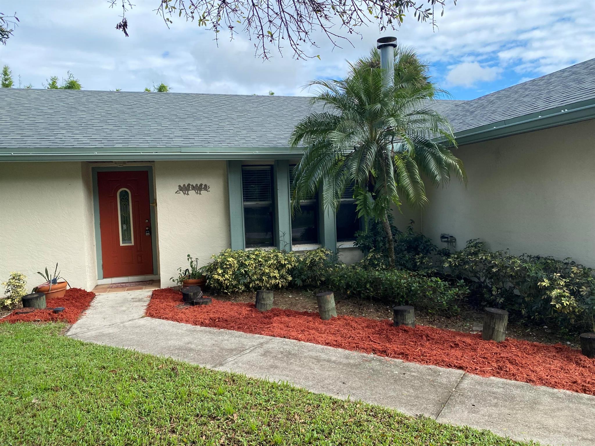 Welcome home to this tranquil 3/2 CBS pool home with fenced yard nestled amongst bamboo and tropical foliage for the ultimate privacy when entertaining or just spending quiet time with the family. Home is located on an oversized corner lot in a lovely highly desirable quiet neighborhood with no through traffic or HOA to pay! Screened in pool has a great lounging area right off of the spanish tiled lanai with an extended deck complete with a porch swing to relax on! Home includes newer: 2022 roof, laminate flooring in living, bedrooms and baths, updated lighting in most rooms, and newer stainless steel appliances in kitchen that overlooks the pool! Driveway is oversized for your outdoor toys with an installed 30 amp hookup. Pride of ownership is evident in every aspect of this meticulously