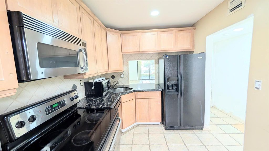 Photo of 860 SE 6th Avenue #205, Deerfield Beach, FL 33441 (MLS # R11133704)