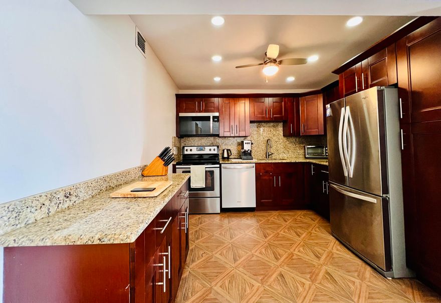 Spacious & Updated With Water Views in 55+ Century Village! Fantastic 1/1.5 Floor Plan In The Luxury Wellington Section. Nicely Appointed Updated Kitchen W/ Shaker Style Cabinets, Stainless Appliances, and Grante Counters. Updated Baths. Tile Flooring Throughout. Large Bedroom Suite With Access to the Enclosed Lanai and Two Closets - Including A Very Large Walk-in Closet. Accordion Shutters Front & Back for Hurricane Protection. Luxury Building With Elevator, Extra Storage, Trash Chutes, and Access to the Two Private Pools for Wellington Section Residents! Century Village Is A Vibrant 55+ Community Centrally Located in Highly Desirable Palm Beach County , Florida! Enjoy An Active Lifestyle With Resort Style Amenities..