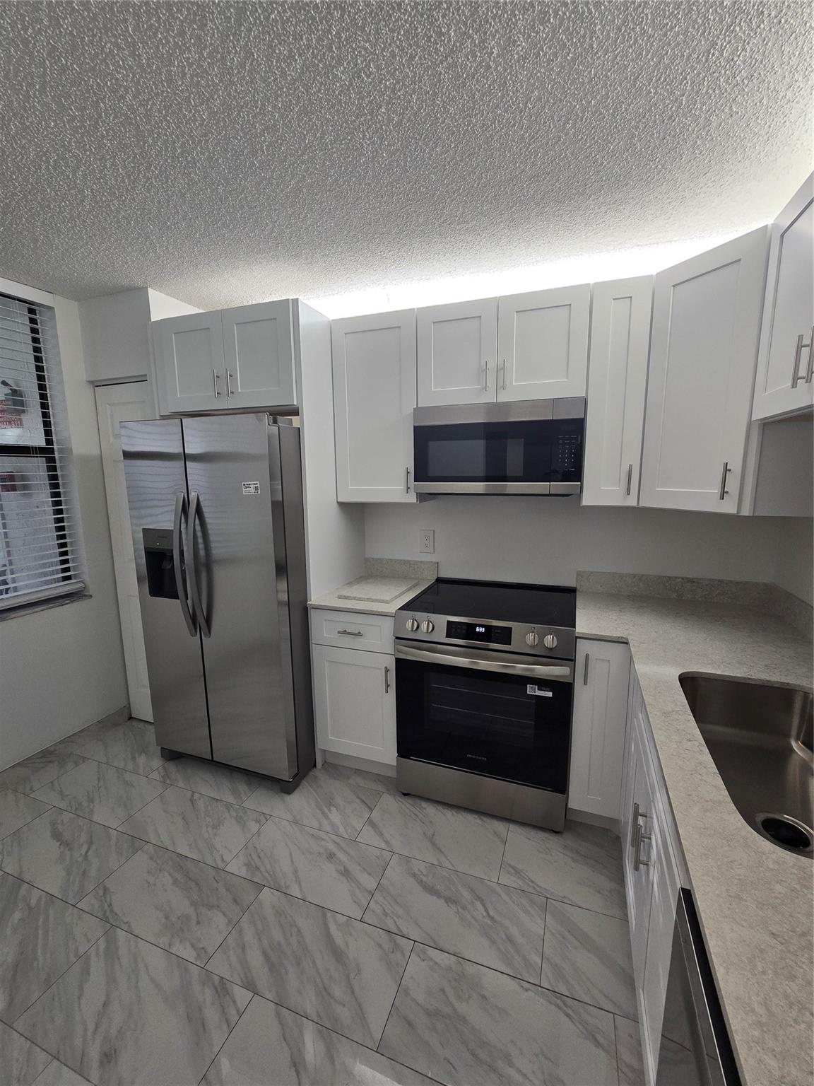Recently renovated and freshly painted! This spacious 2 bed/2 bath 2nd floor condo features a remodeled kitchen with brand-new appliances, bright open layout, washer & dryer in unit, and an oversized screened balcony perfect for relaxing or entertaining. Enjoy resort-style amenities including clubhouse, fitness center, pool & Jacuzzi. Prime location close to shopping, dining, I-95, the Turnpike, and just minutes to the beach—ideal for both commuters and beach lovers. Lease terms: first, last & security required plus $500 non-refundable pet deposit. Tenant responsible for FOB & parking decals. Proof of income and credit report required. Easy to show—schedule your private tour today and make this beautifully updated condo your new home!
